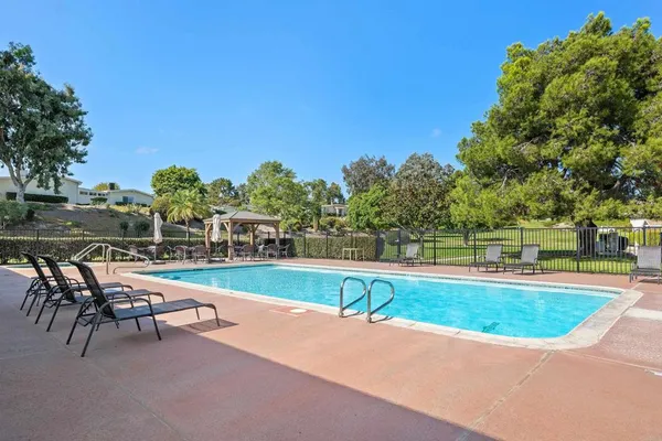 a view of a swimming pool with a patio