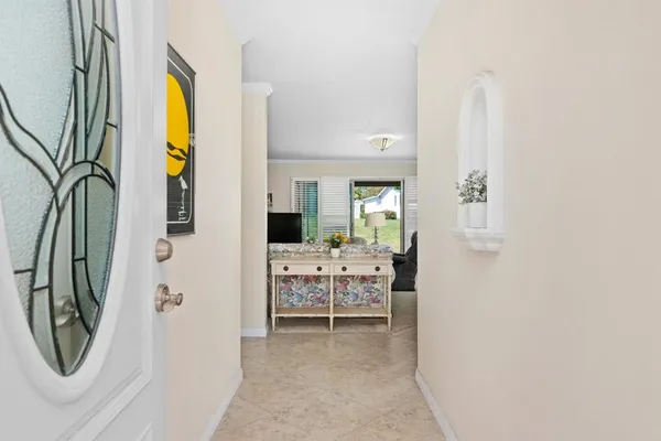 a view of livingroom with furniture and front door