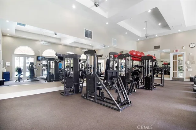 a swimming pool view with large trees