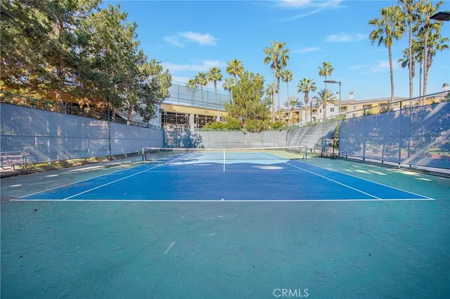 a view of a room with large windows and wooden floor