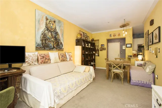 a bed room with a bed and a chair