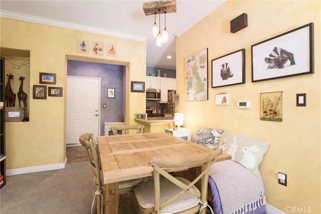 a dining room with furniture and window