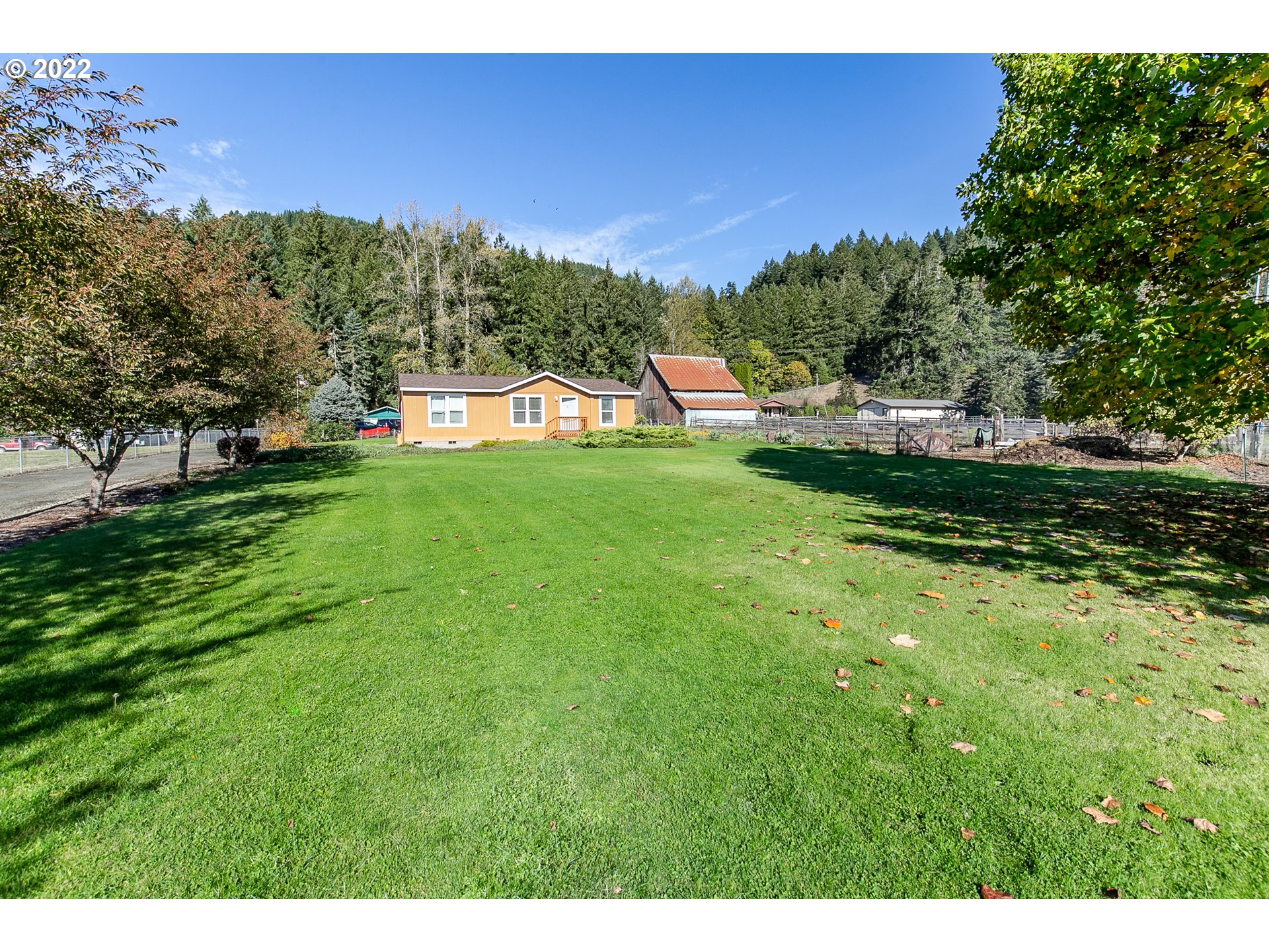 34785 Row River Road Cottage Grove, OR 97424 - Photo 2 of 31 a view of a garden from a building