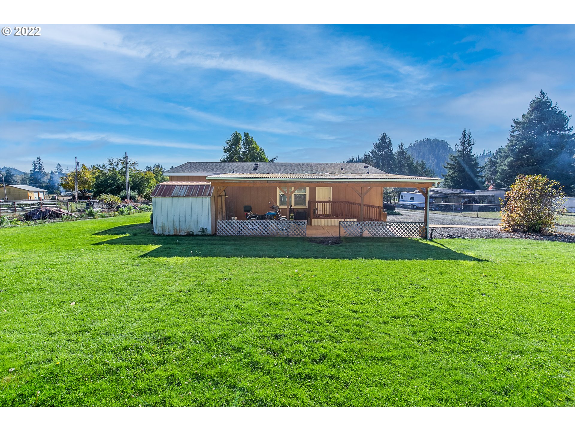 34785 Row River Road Cottage Grove, OR 97424 - Photo 8 of 31 a view of a house with a big yard