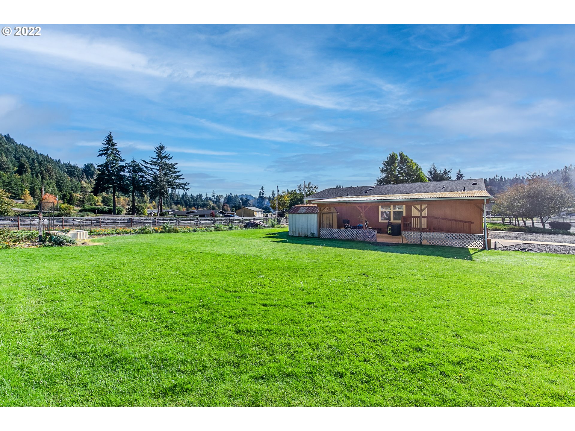 34785 Row River Road Cottage Grove, OR 97424 - Photo 10 of 31 a view of an house with a big yard