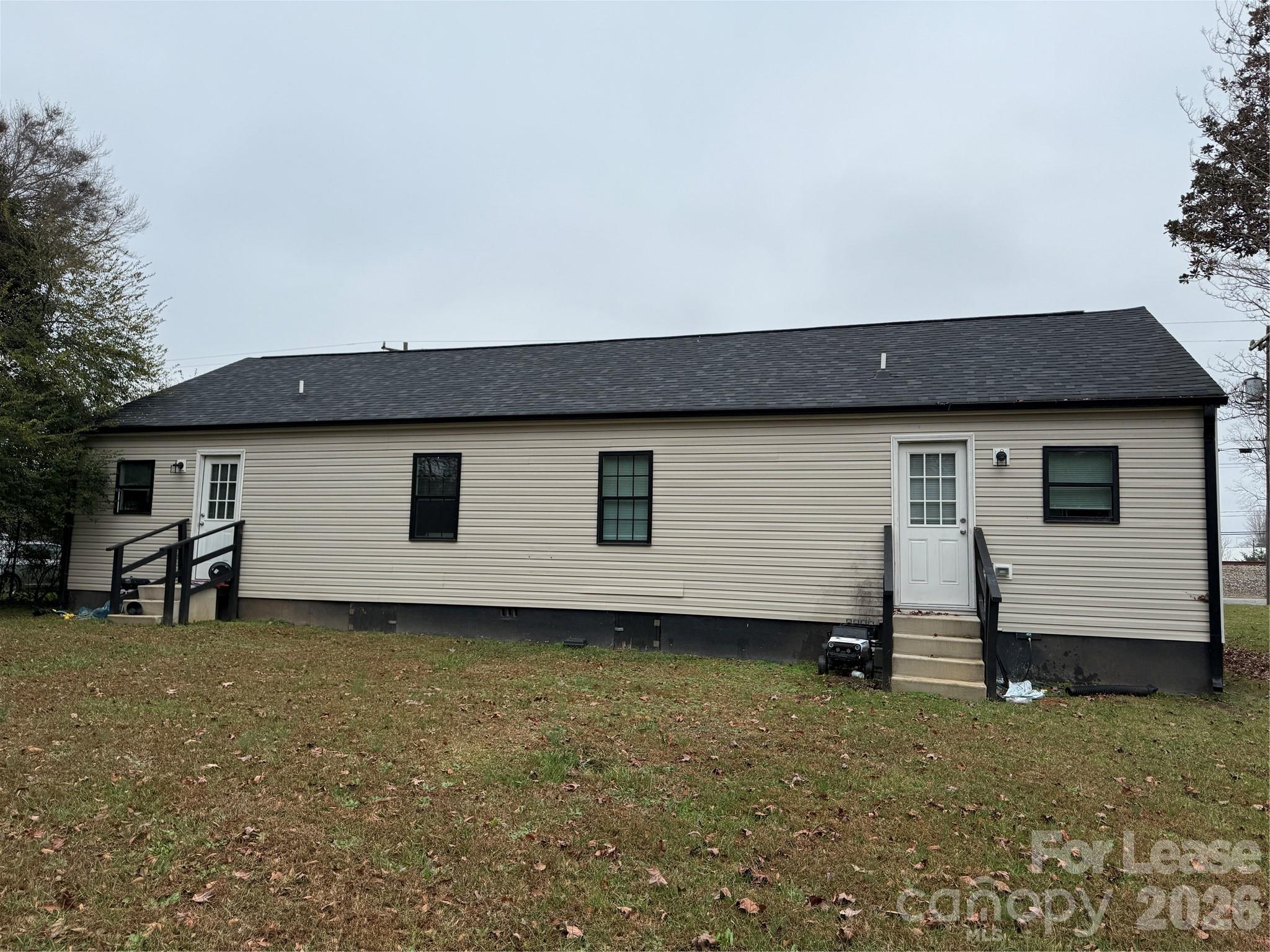 705 North Main Street Stanley, NC 28164 - Photo 10 of 10 a view of a house with backyard