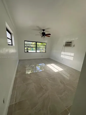 a view of a hallway with windows