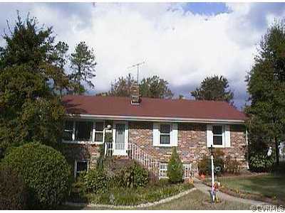 4308 Milsmith Road Chester, VA 23831 - Photo 1 of 1 a front view of a house with street