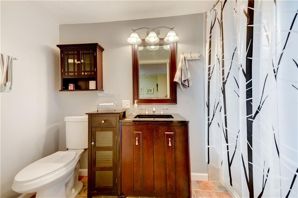 5618 Aiken Road McKees Rocks, PA 15136 - Photo 14 of 22 a bathroom with a toilet sink and mirror