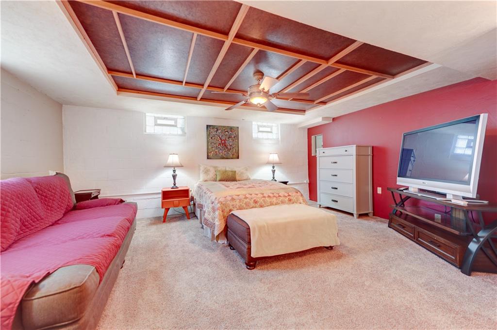 5618 Aiken Road McKees Rocks, PA 15136 - Photo 18 of 22 a bedroom with a bed and a flat screen tv