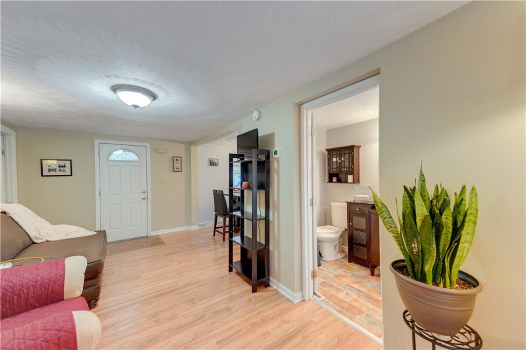 5618 Aiken Road McKees Rocks, PA 15136 - Photo 5 of 22 a living room with furniture and a potted plant