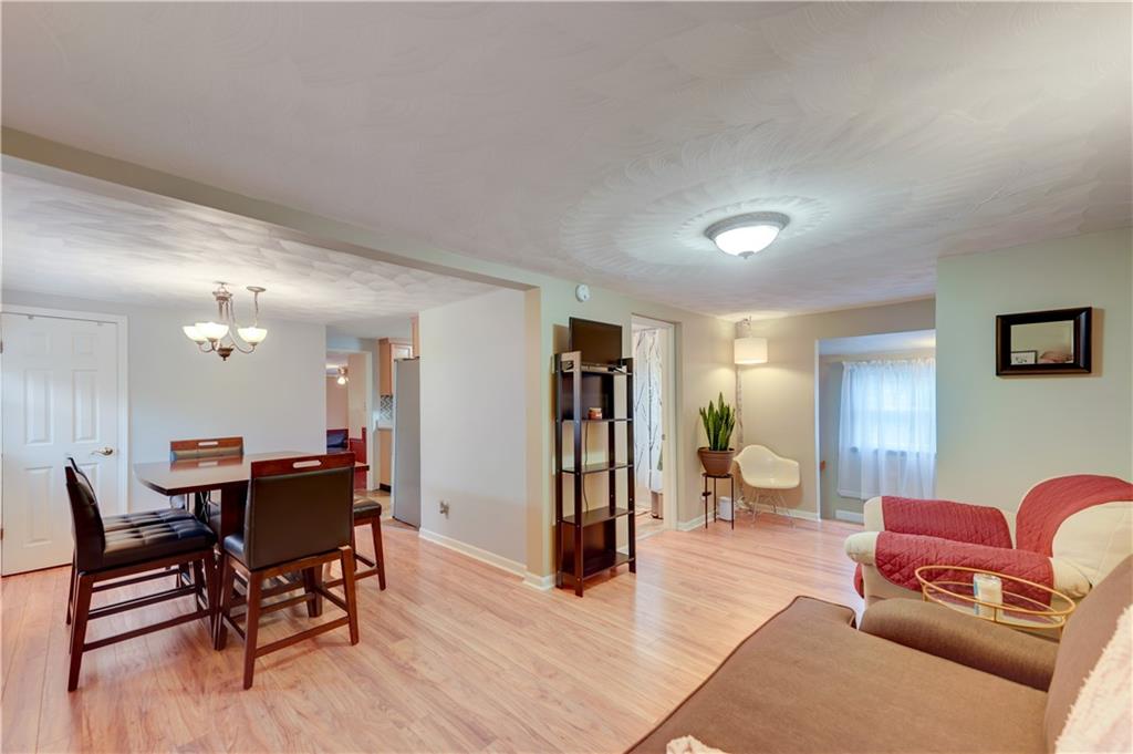 5618 Aiken Road McKees Rocks, PA 15136 - Photo 6 of 22 a view of a livingroom with furniture and dining room