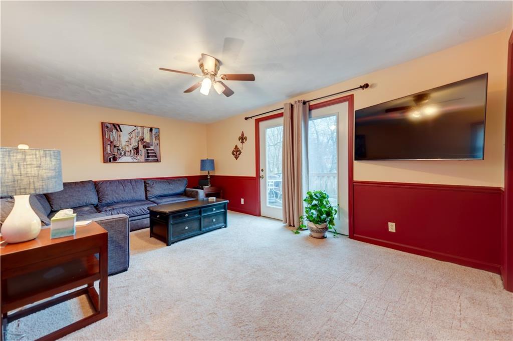 5618 Aiken Road McKees Rocks, PA 15136 - Photo 10 of 22 a living room with furniture and a flat screen tv