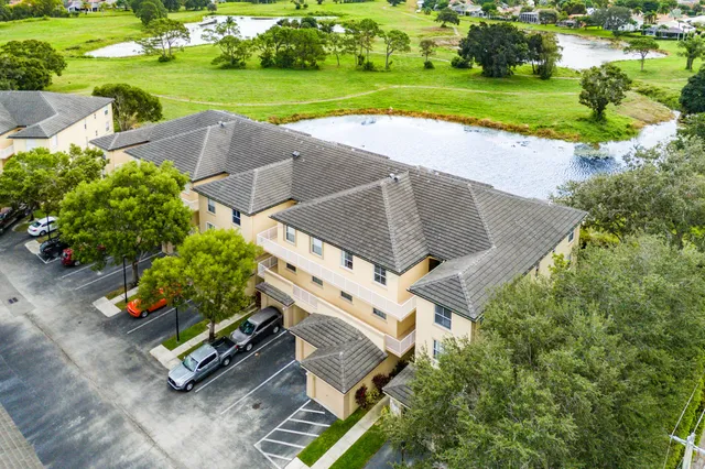 an aerial view of a house with garden space and street view