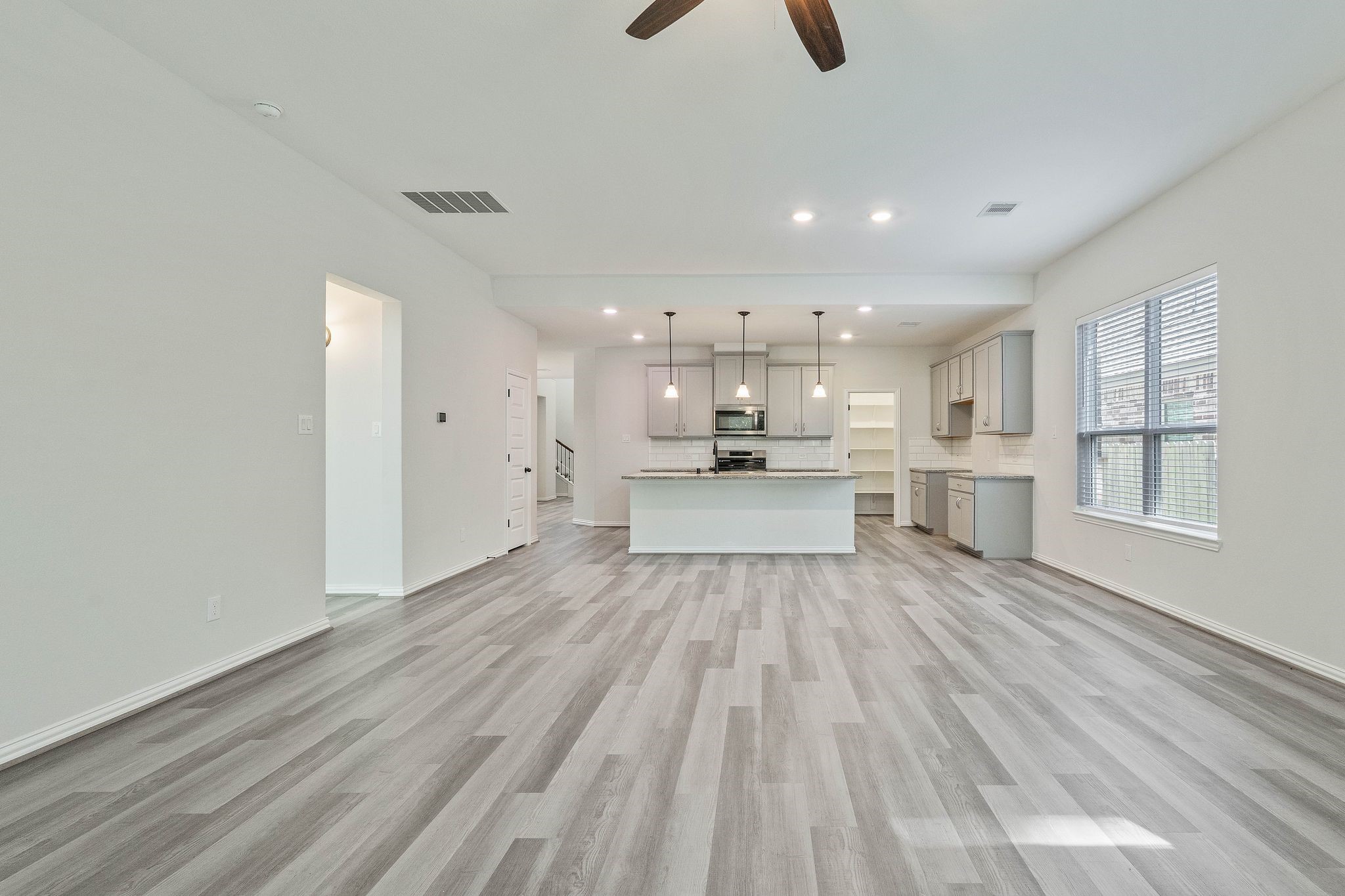143 Scarlet Maple Way Conroe, TX 77318 - Photo 7 of 28 Kitchen is open to the living room.