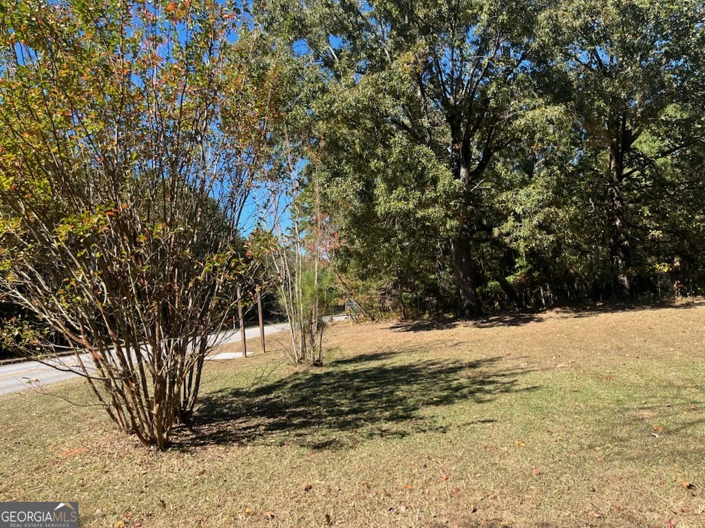 7942 Rand Road Jonesboro, GA 30236 - Photo 1 of 1 a view of a yard covered with snow in front of house