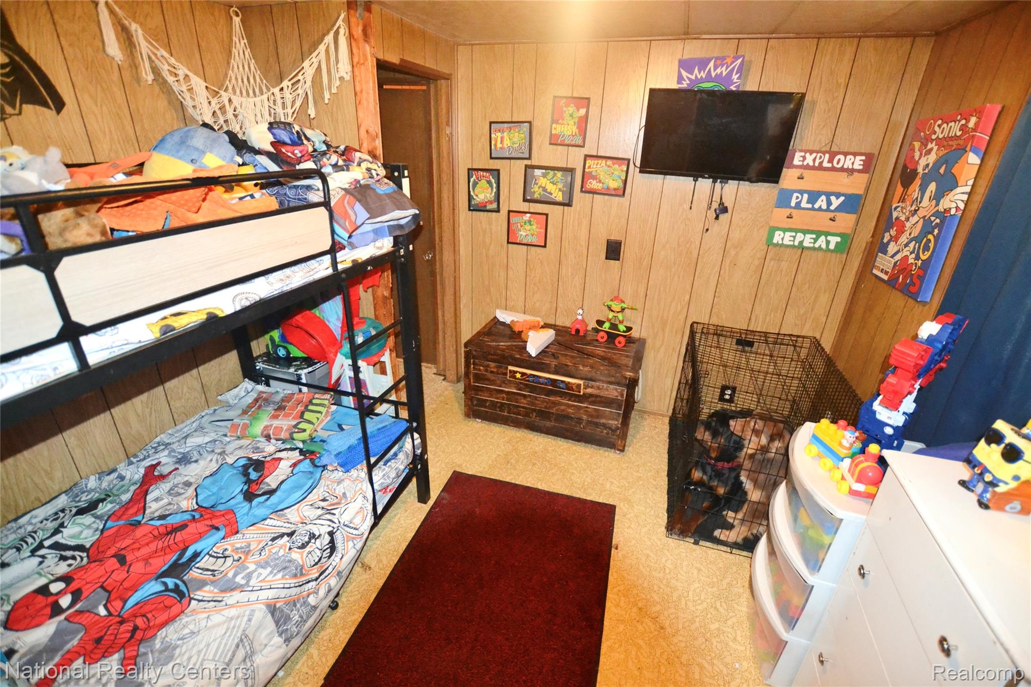 3088 7 Mile Road Sears, MI 49679 - Photo 11 of 27 Bedroom 1 - View 1 - Carpeted bedroom featuring wooden walls