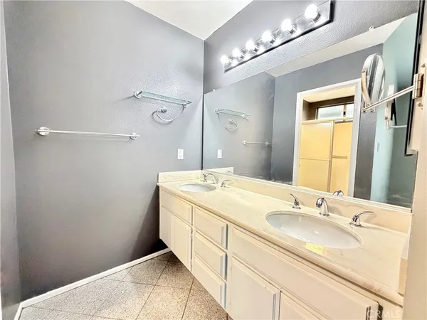 a spacious bathroom with a sink toilet and shower
