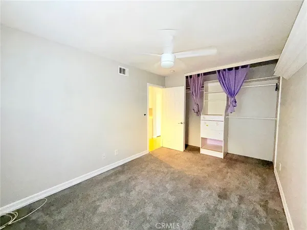 a view of a house with a backyard and a patio