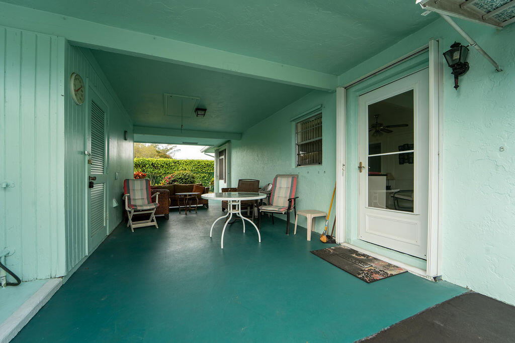 622 Hummingbird Lane Delray Beach, FL 33445 - Photo 26 of 36 Covered side patio