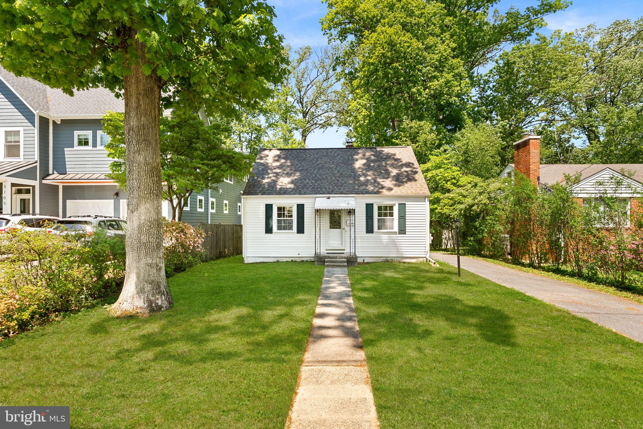 3103 Plyers Mill Road Kensington, MD 20895 - Photo 1 of 32 a front view of a house with a yard