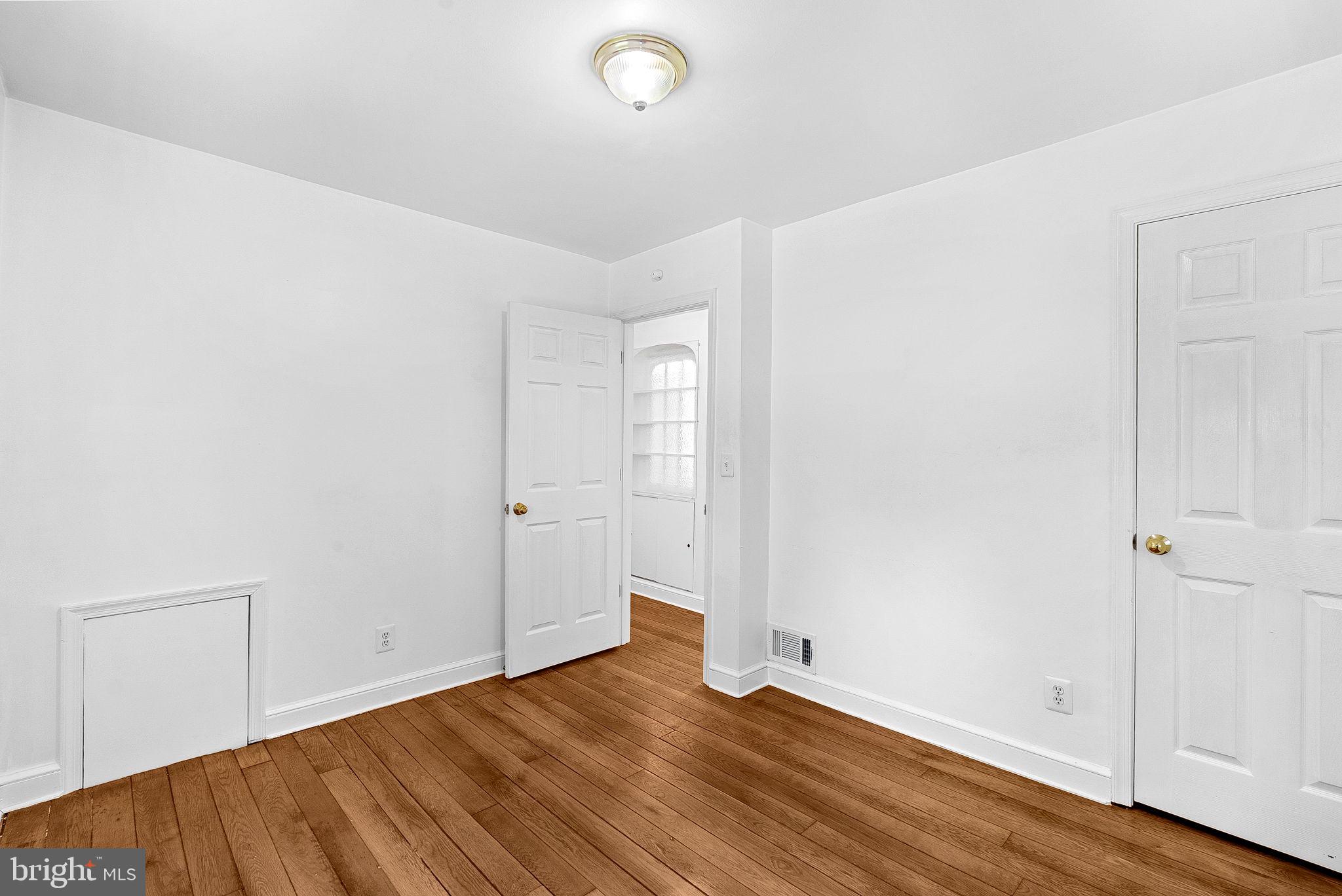 3103 Plyers Mill Road Kensington, MD 20895 - Photo 16 of 32 an empty room with wooden floor