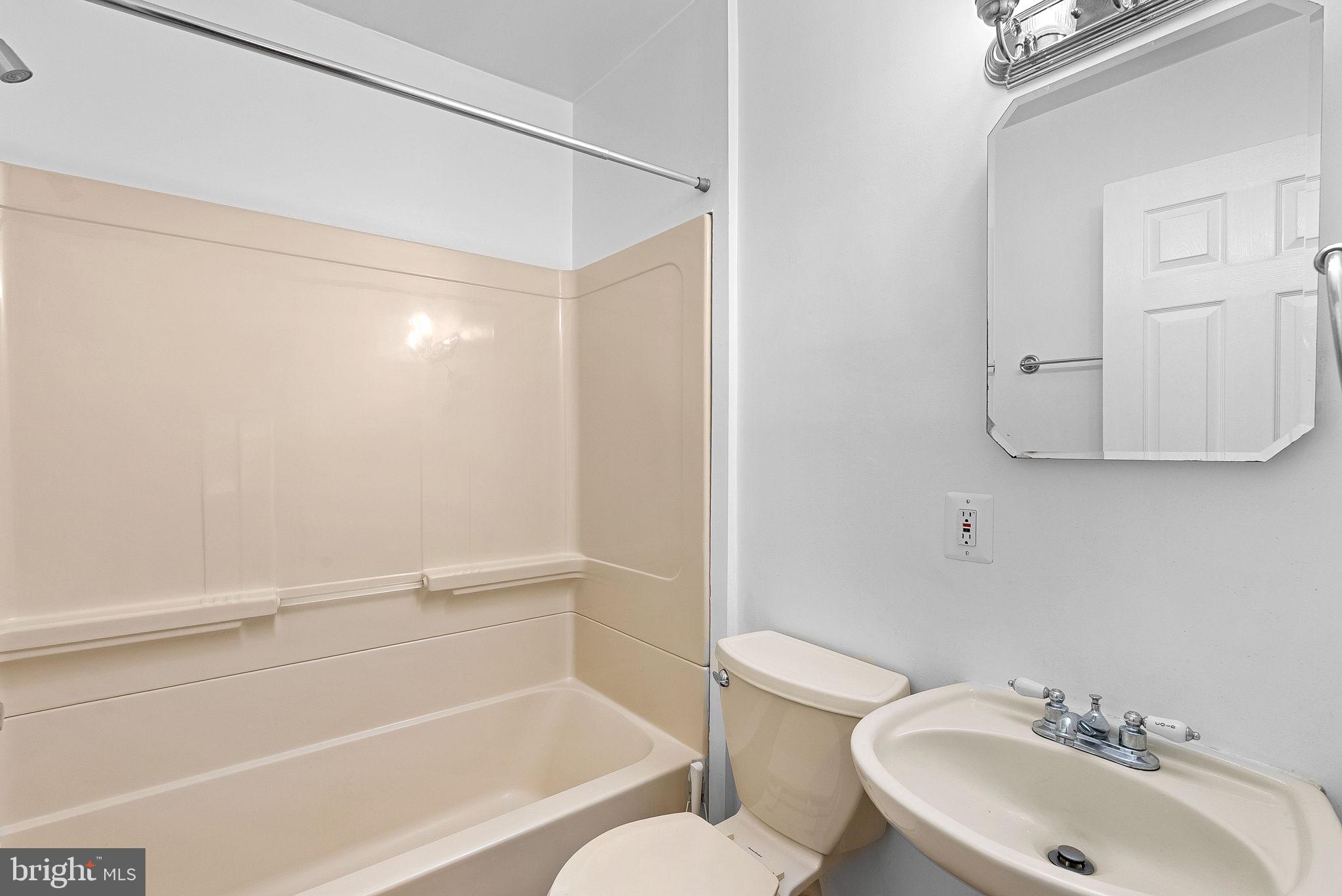 3103 Plyers Mill Road Kensington, MD 20895 - Photo 17 of 32 a bathroom with a sink toilet and shower