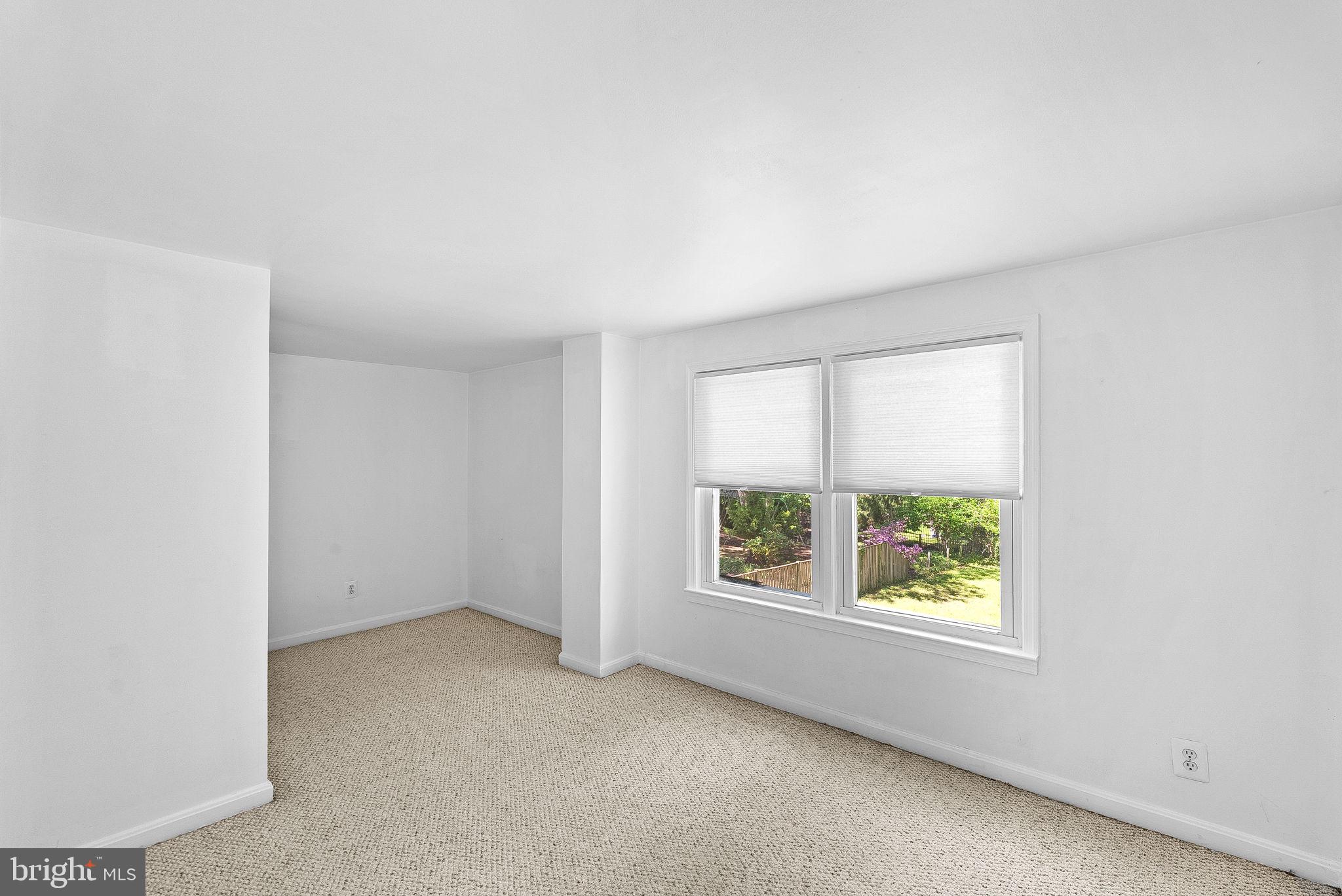 3103 Plyers Mill Road Kensington, MD 20895 - Photo 18 of 32 an empty room with windows
