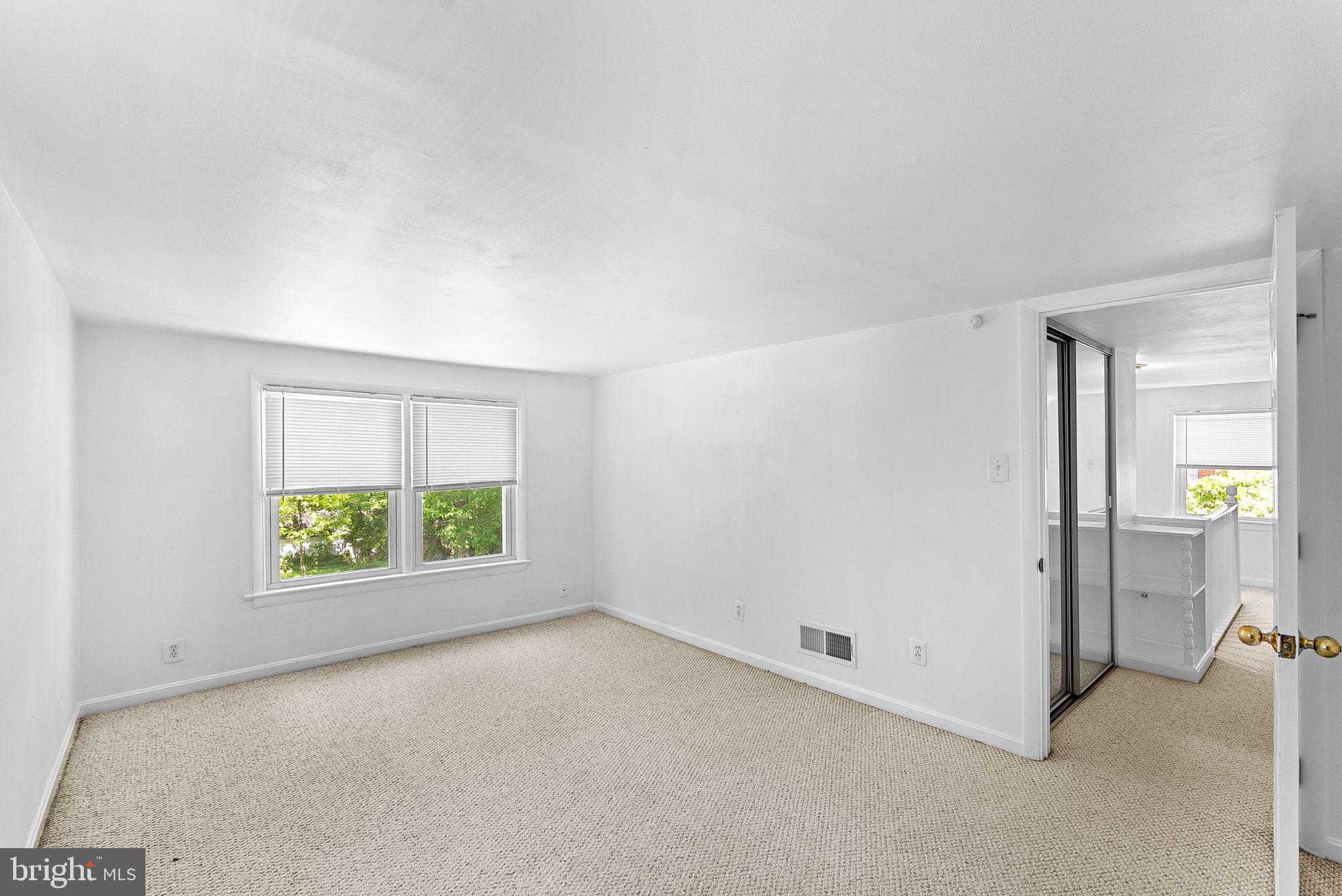 3103 Plyers Mill Road Kensington, MD 20895 - Photo 24 of 32 an empty room with windows and entrance