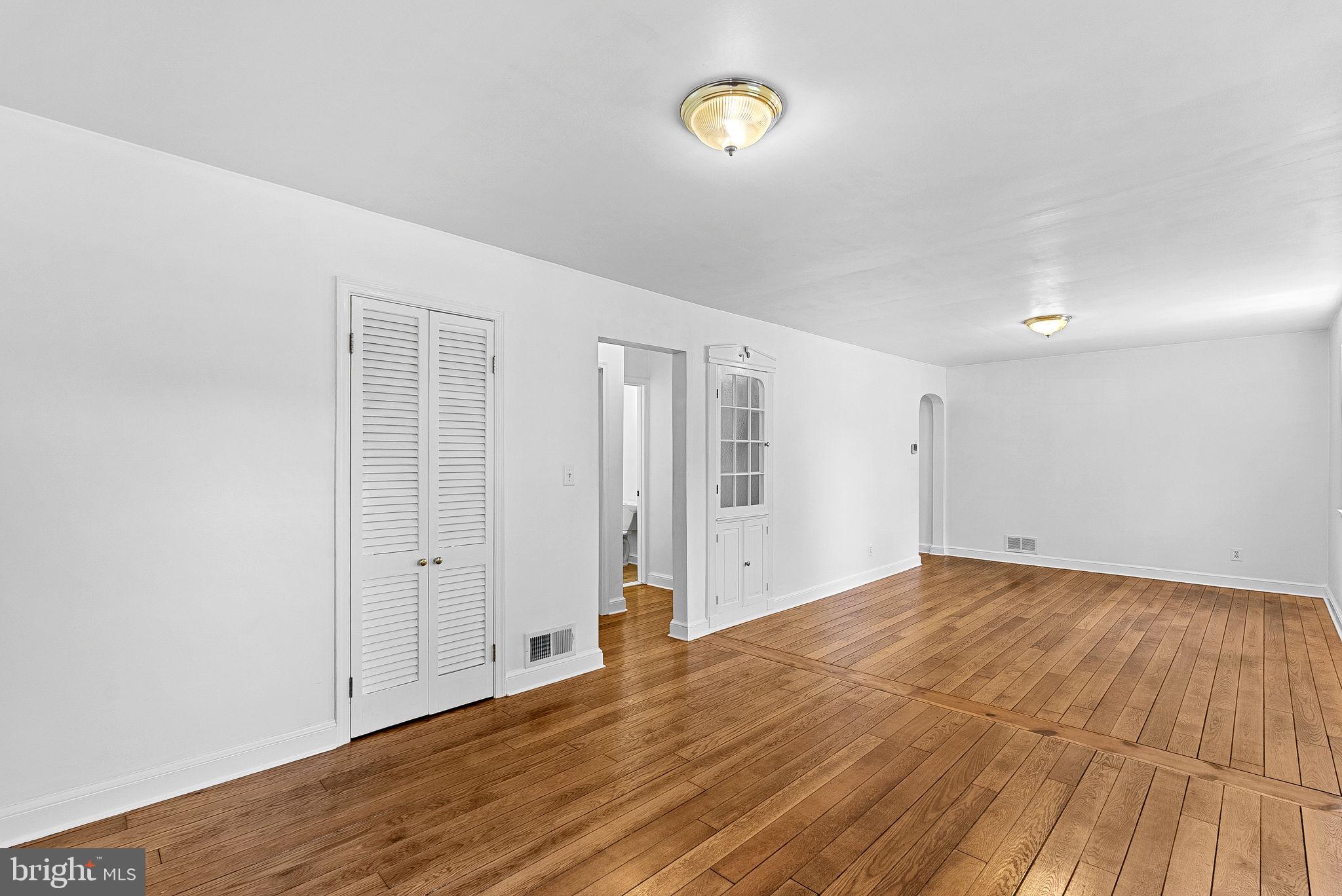 3103 Plyers Mill Road Kensington, MD 20895 - Photo 3 of 32 a view of an empty room with wooden floor