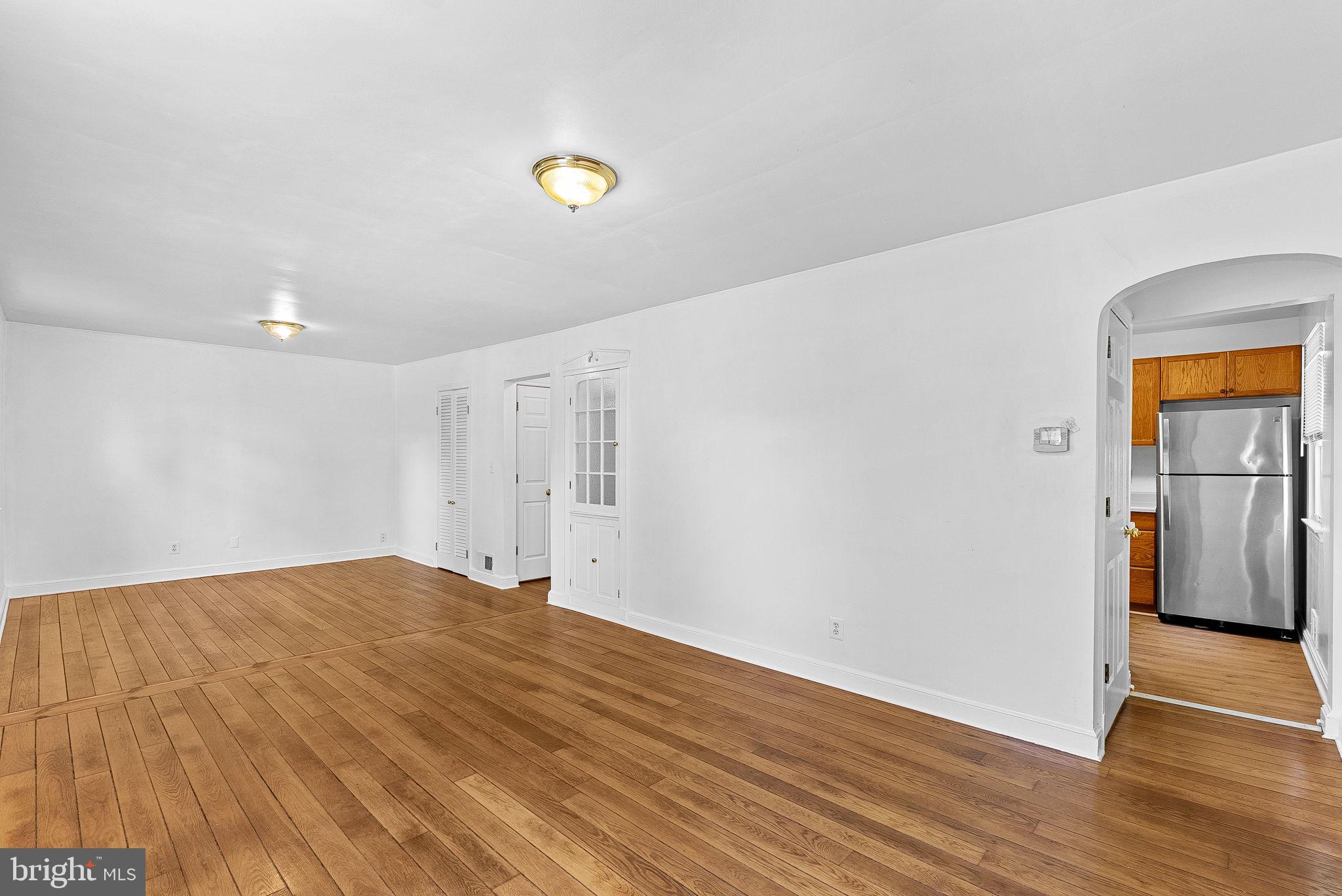 3103 Plyers Mill Road Kensington, MD 20895 - Photo 6 of 32 a view of empty room with wooden floor