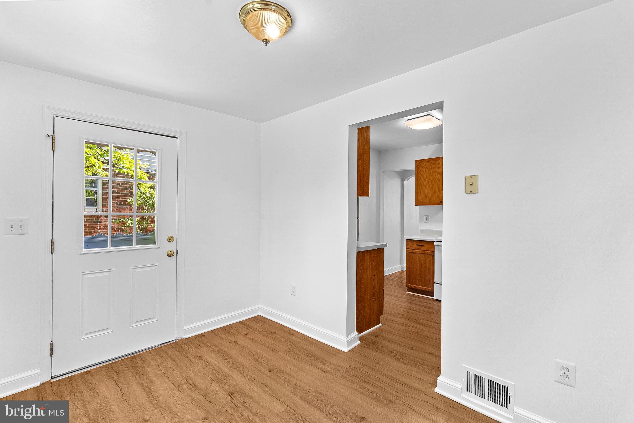 3103 Plyers Mill Road Kensington, MD 20895 - Photo 8 of 32 a view of empty room with wooden floor and fan