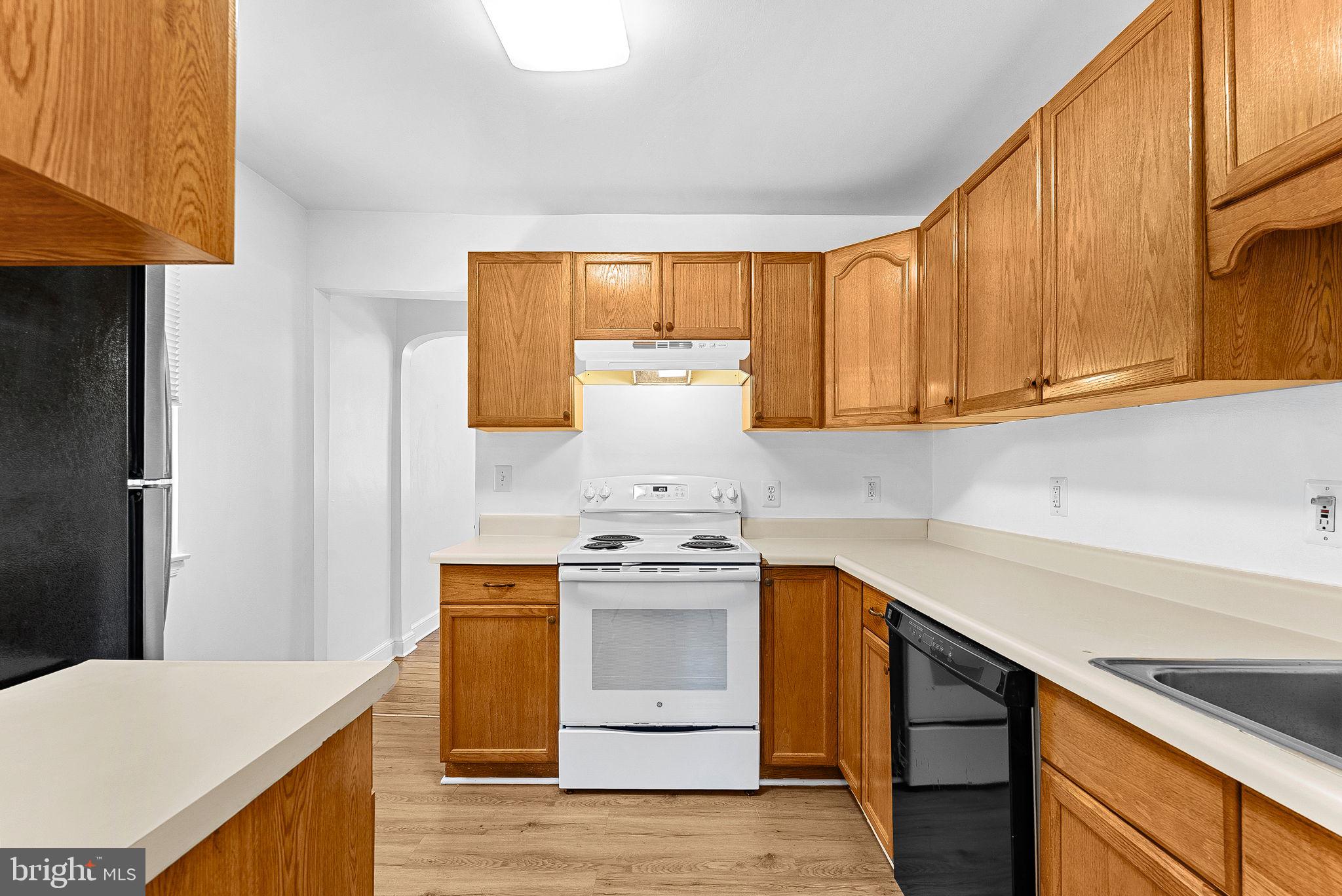3103 Plyers Mill Road Kensington, MD 20895 - Photo 10 of 32 a kitchen with a stove and a sink