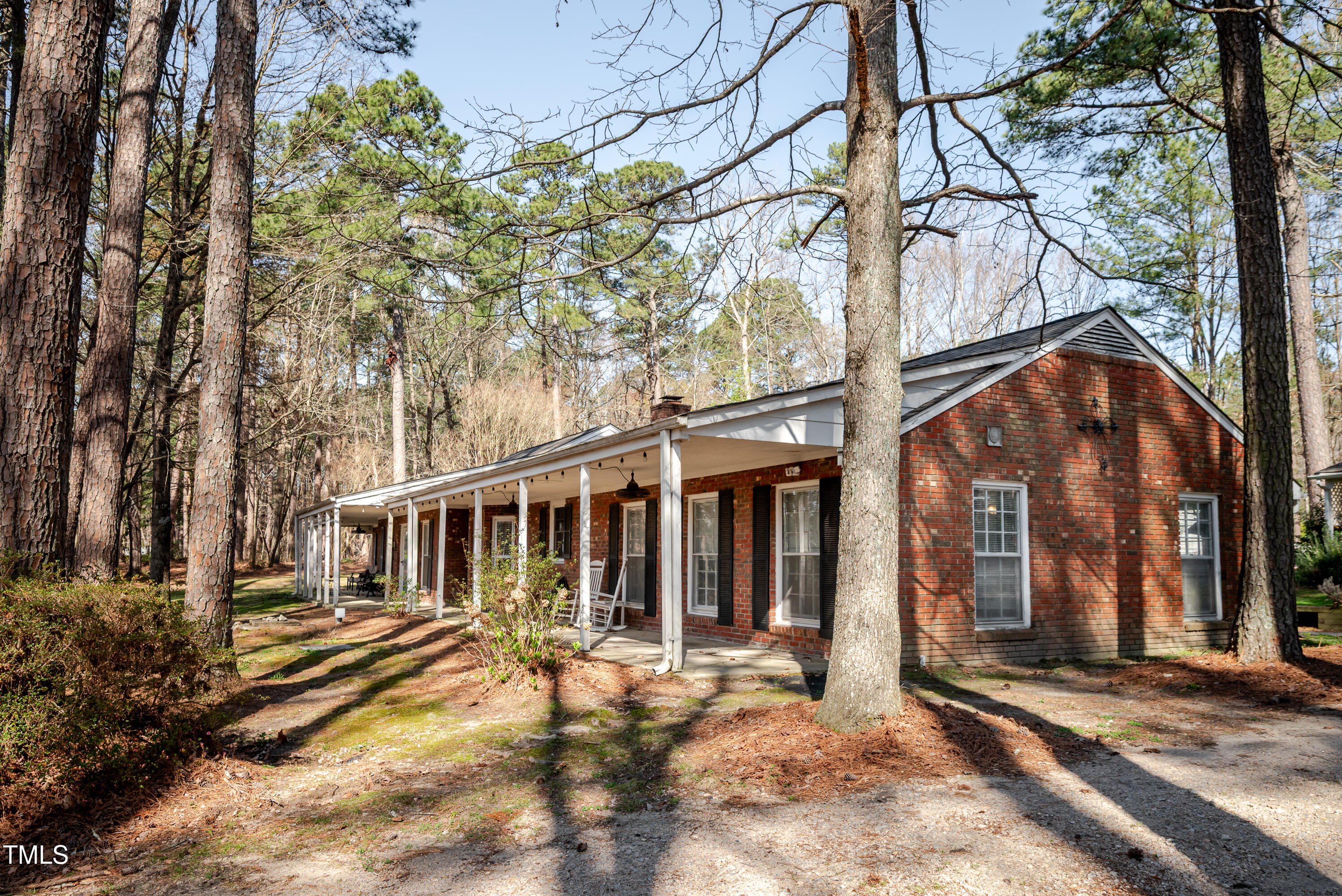 4105 Lassiter Road Wake Forest, NC 27587 - Photo 2 of 50 front view of a house with a large tree and wooden fence