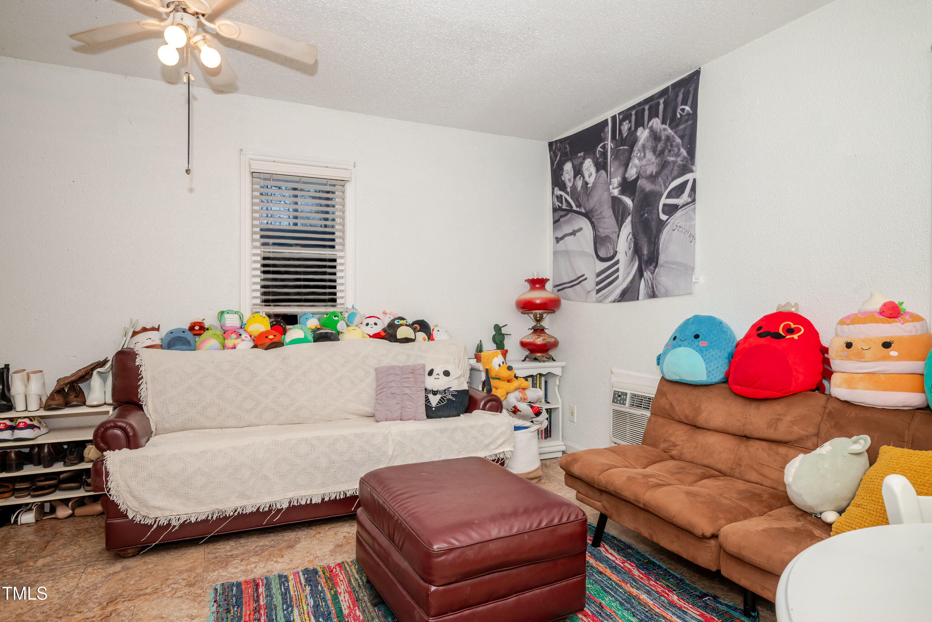 4105 Lassiter Road Wake Forest, NC 27587 - Photo 27 of 50 a living room with furniture and a chandelier