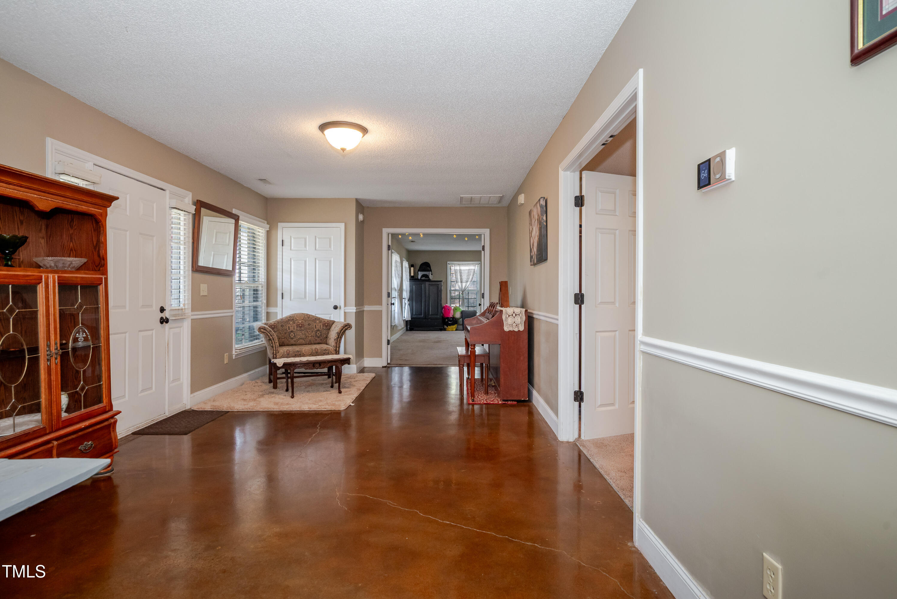 4105 Lassiter Road Wake Forest, NC 27587 - Photo 34 of 50 a living room with furniture and a table