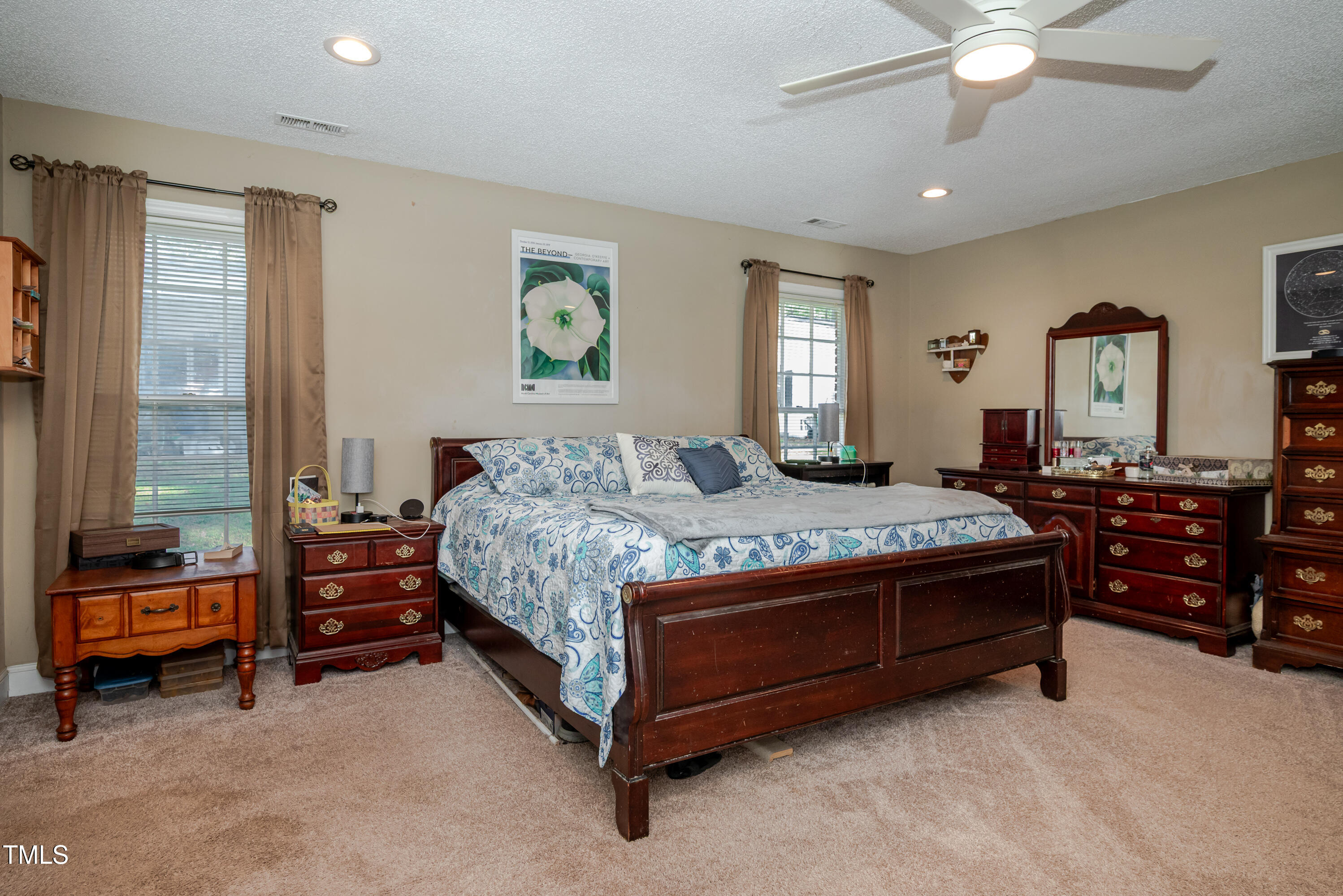 4105 Lassiter Road Wake Forest, NC 27587 - Photo 37 of 50 a bedroom with a bed and a chandelier