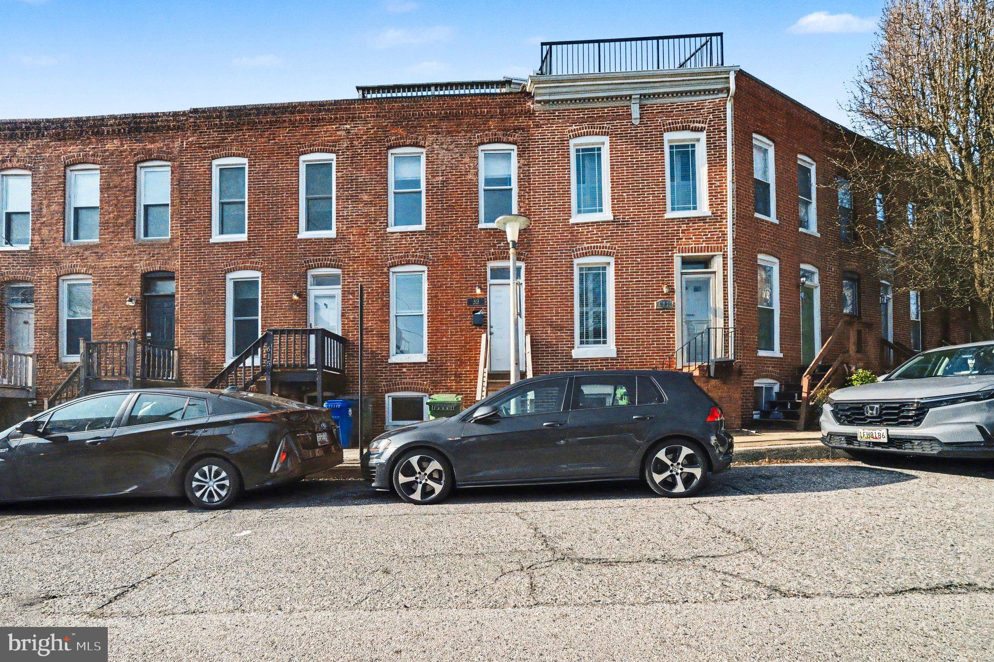 613 Harvey Street Baltimore, MD 21230 - Photo 30 of 33 Charming brick row homes on a sunny street.