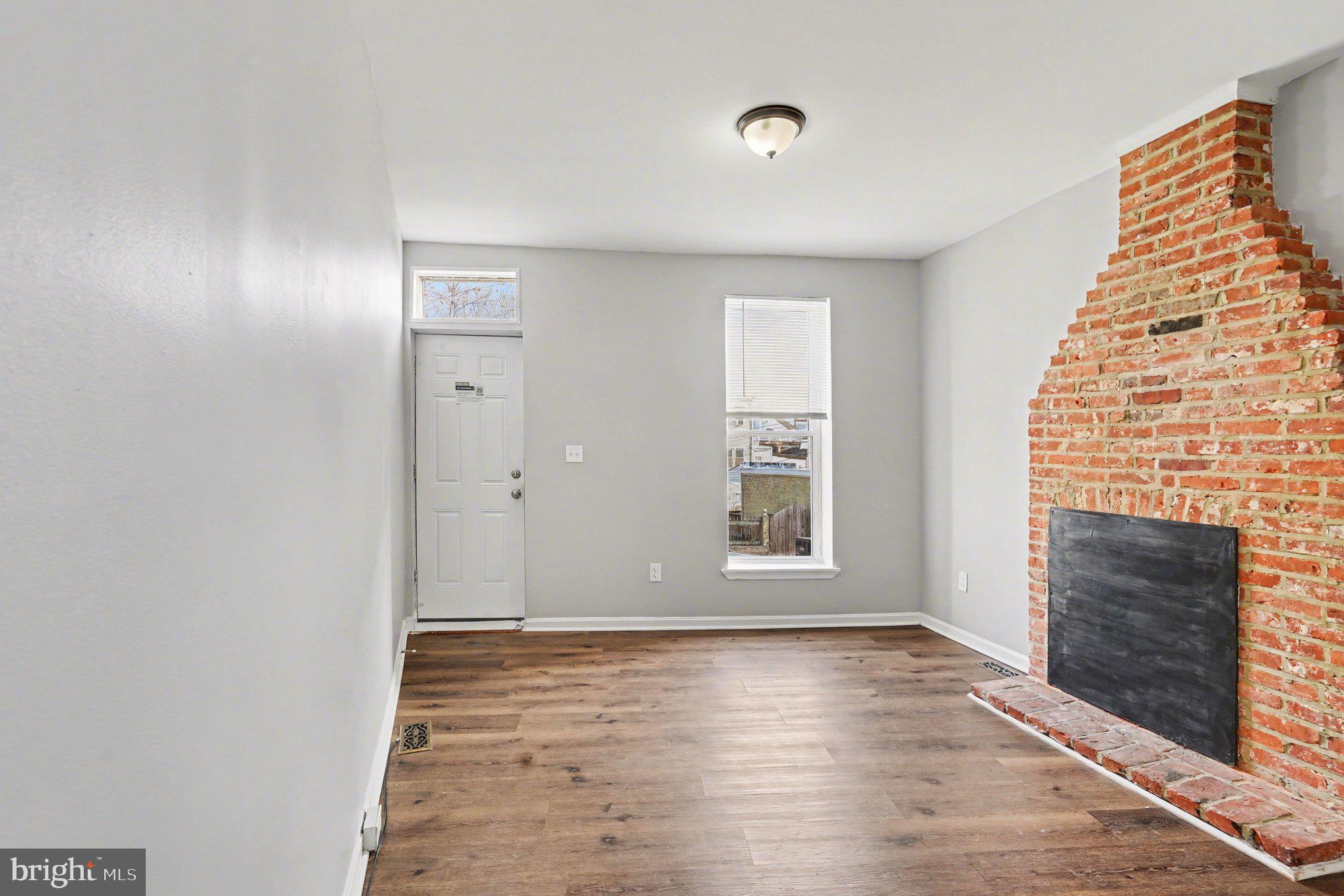 613 Harvey Street Baltimore, MD 21230 - Photo 6 of 33 Charming space with rustic brick accents.