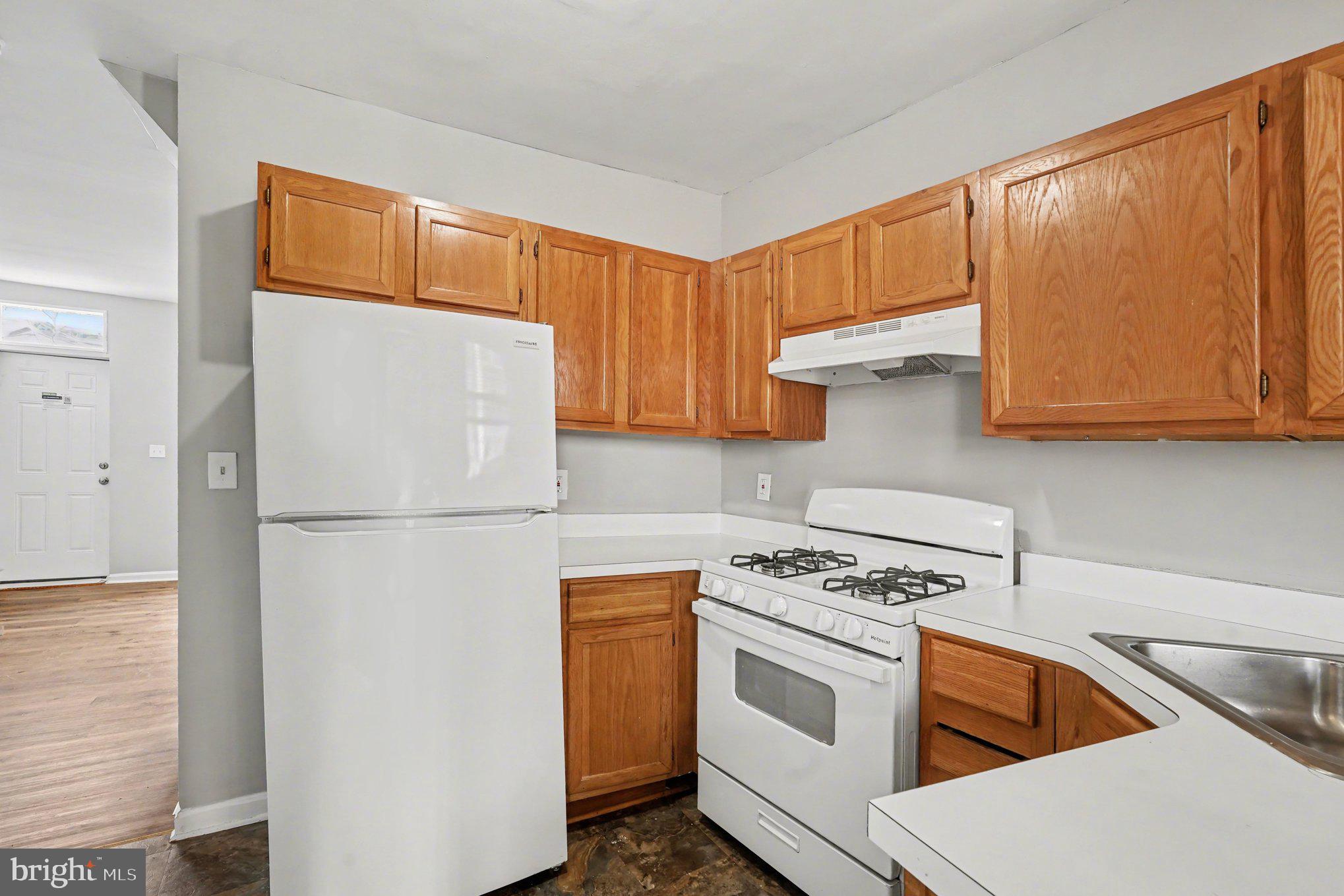 613 Harvey Street Baltimore, MD 21230 - Photo 10 of 33 Cozy kitchen with warm wood accents.
