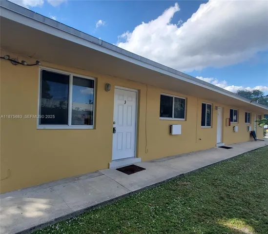 a house view with a backyard space