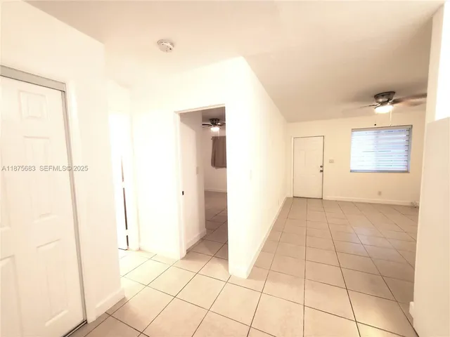 a view of an empty room and window