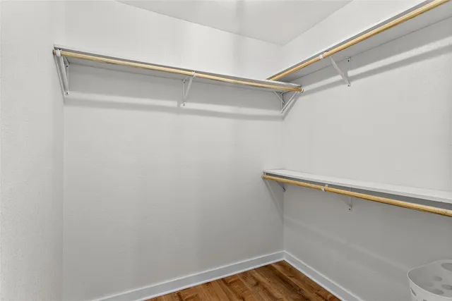 a bathroom with a double vanity sink a toilet and a shower