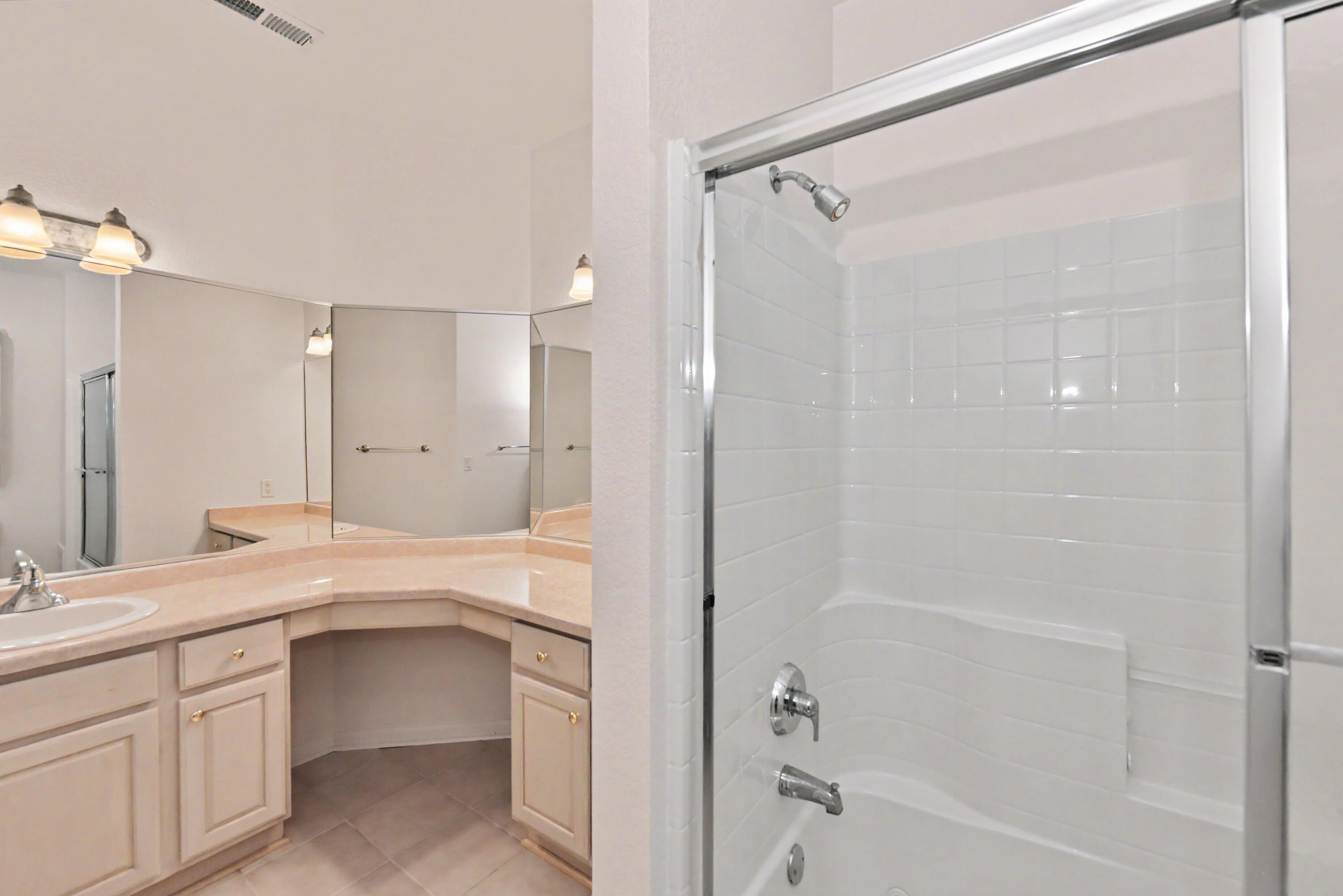 13050 West Bluemound Road, Unit 203 Elm Grove, WI 53122 - Photo 12 of 24 Primary bath with shower over jetted tub