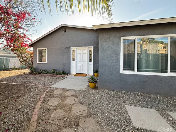 a backyard of a house with seating space