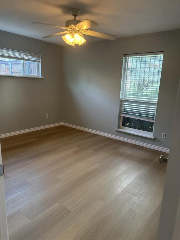 3417 Blue Ridge Lane Garland, TX 75042 - Photo 6 of 9 a view of an empty room with a window