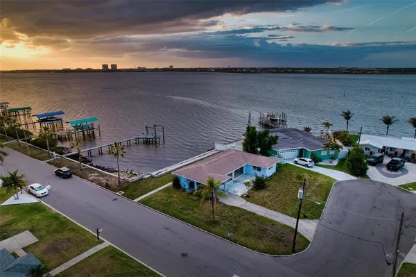 an aerial view of a house with lake view