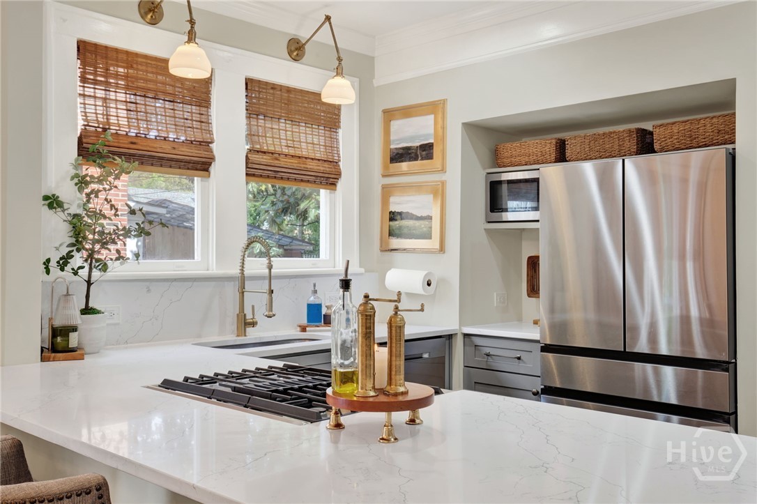 208 East 48th Street Savannah, GA 31405 - Photo 14 of 50 Island area with all new stainless steel appliances, countertops, sink and custom cabinets and lighting.