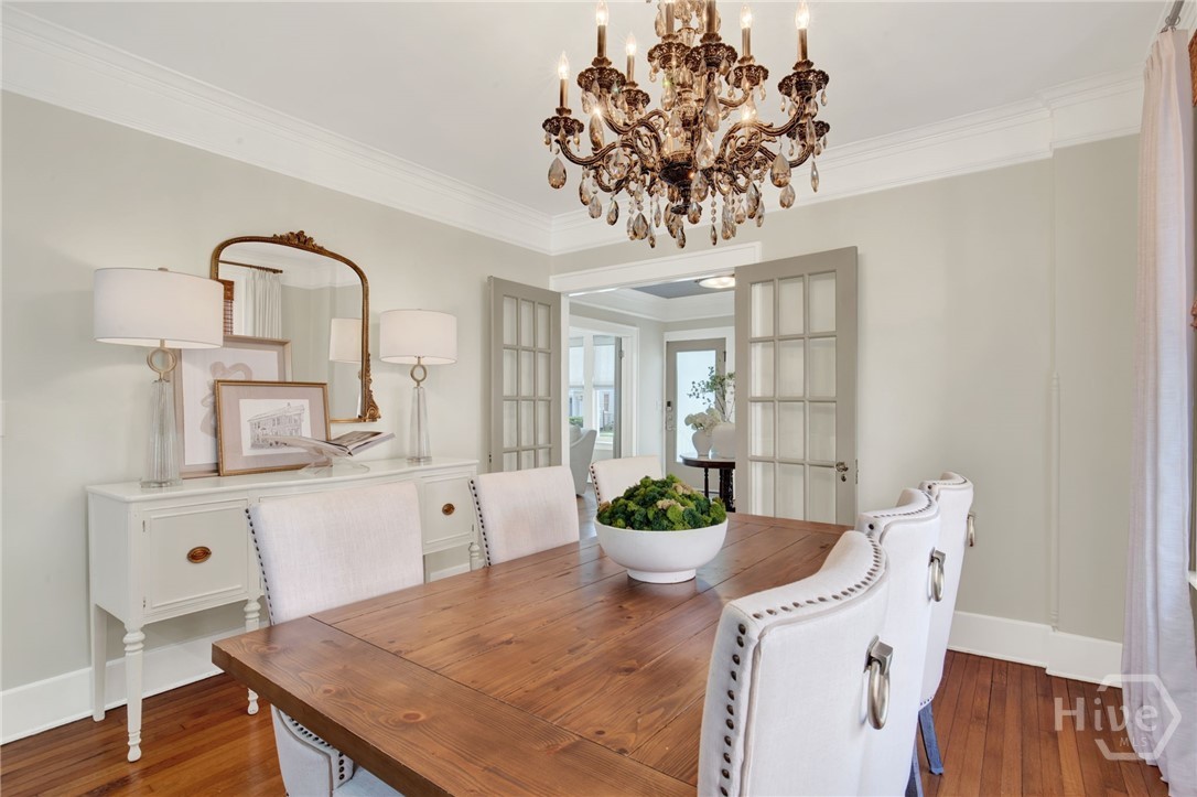 208 East 48th Street Savannah, GA 31405 - Photo 21 of 50 Dining room has glass doors leading to the foyer.