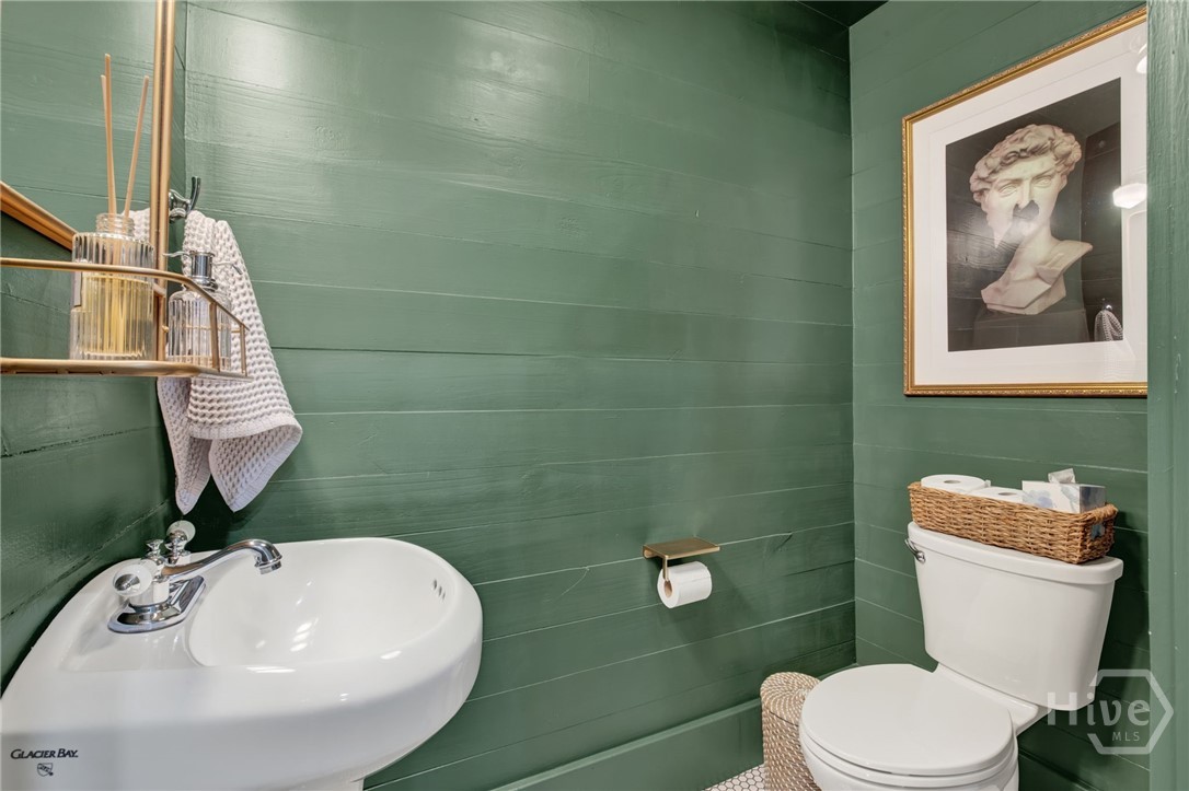 208 East 48th Street Savannah, GA 31405 - Photo 22 of 50 Half bath downstairs off of the kitchen. Ship lap walls.